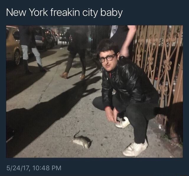 pic of guy crouching next to a dead rat captioned New York freakin city baby.